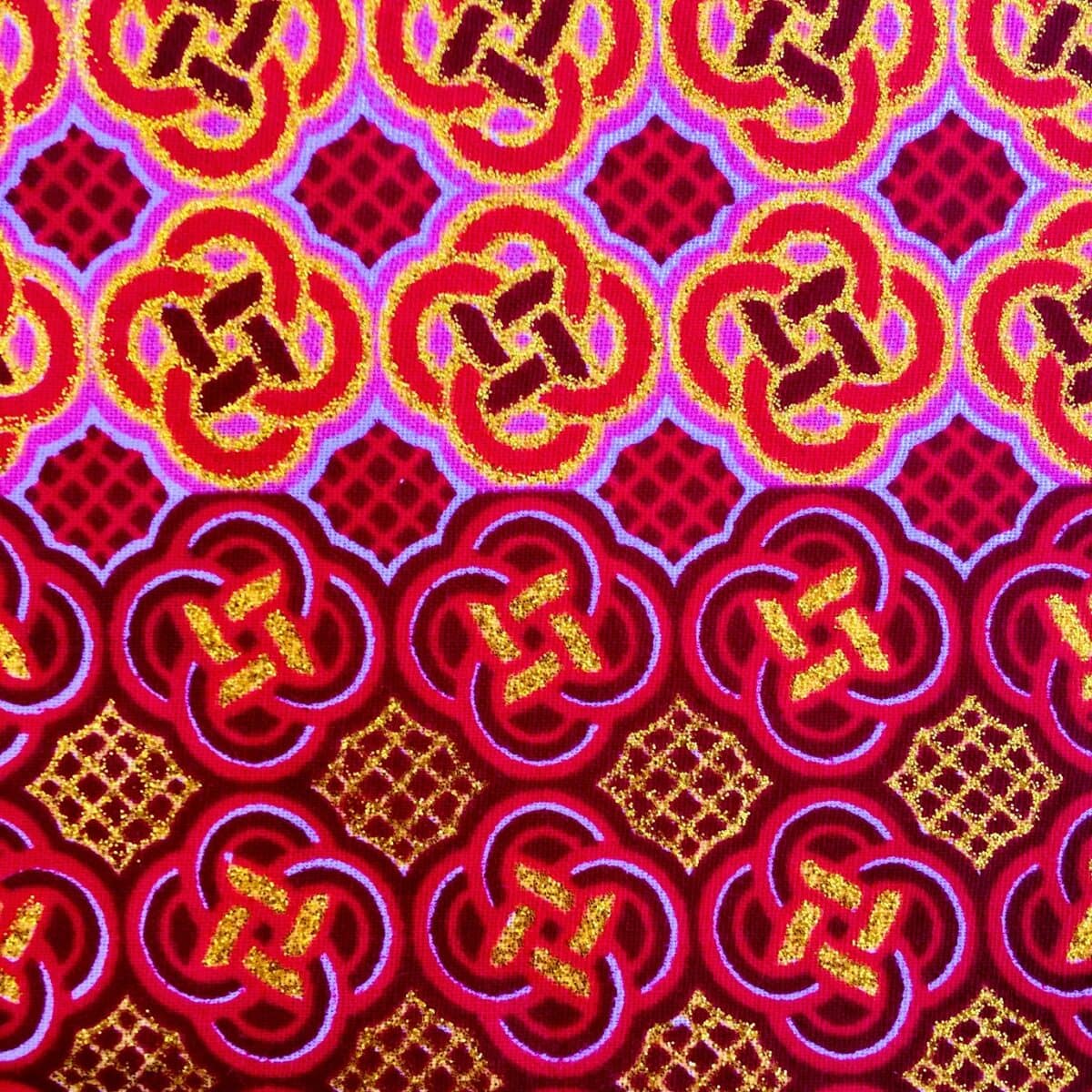 Tissu Wax pailleté fuchsia orangé imprimé Celte détail bordure