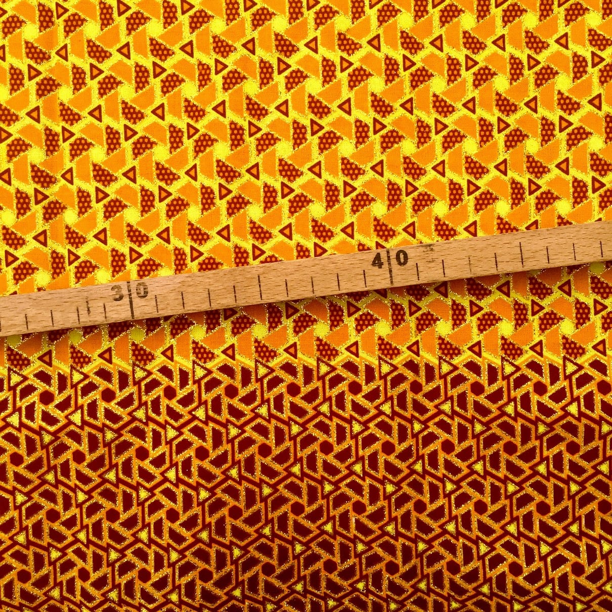 Tissu Wax pailleté jaune orange doré imprimé Mini triangles bordure