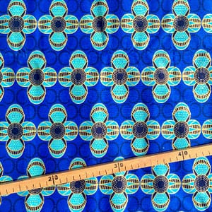 Tissu Wax pailleté bleu doré imprimé Fleurs