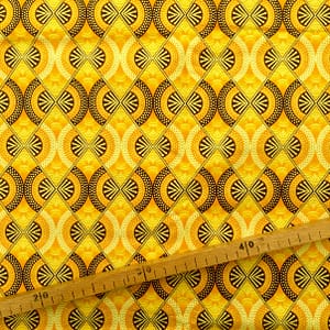 Tissu Wax pailleté jaune marron doré imprimé Demi-lunes