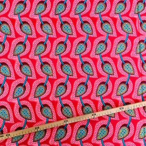 Tissu Wax pailleté corail imprimé Tulipes