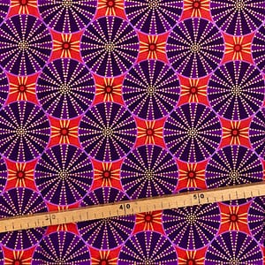 Tissu Wax pailleté violet orange imprimé Circus