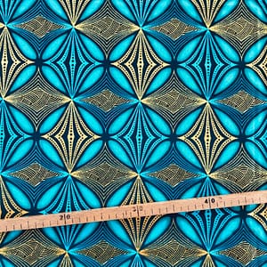 Tissu Wax pailleté vert turquoise imprimé Circulaire
