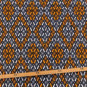 Tissu Wax orange noir imprimé Losanges